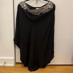 Asymmetrical black top with jewelled neckline. Size L/XL.